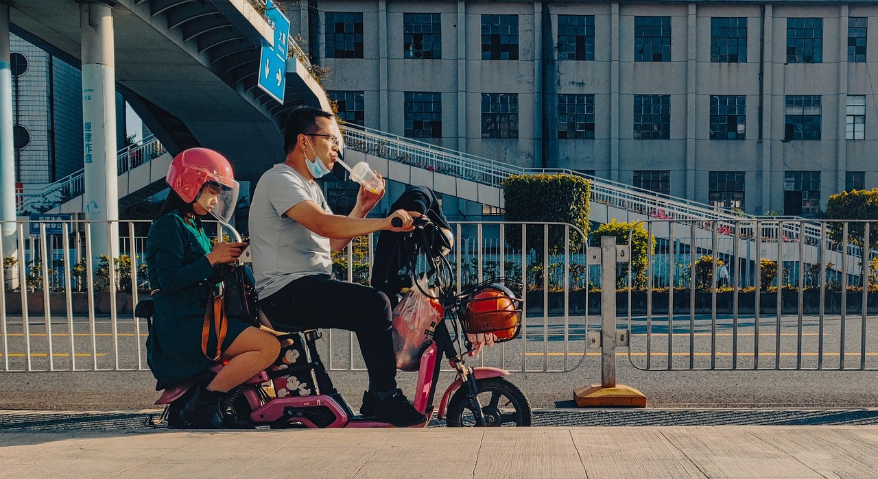 An electric bike locked on a city street at night